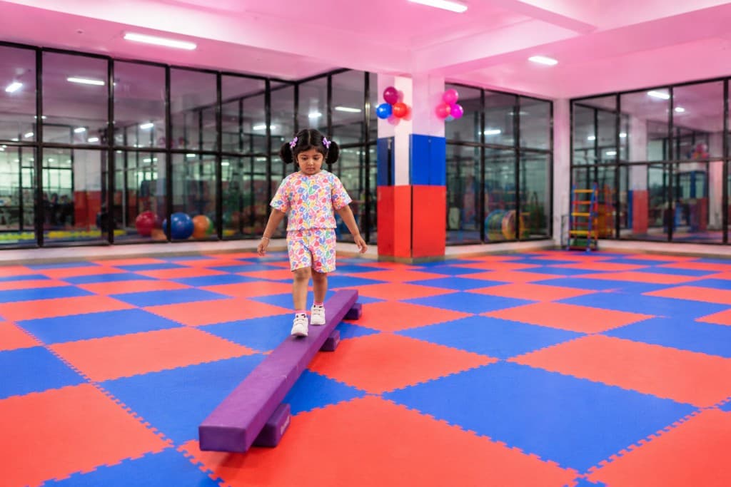 Children enjoying obstacle and movement activities at KidsSportsWorld summer camp